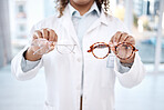 Eye care, vision and woman, choice of glasses in hands, optometrist and healthcare for eyes with doctor. Prescription lens, designer frame and eyewear decision, health insurance and optometry