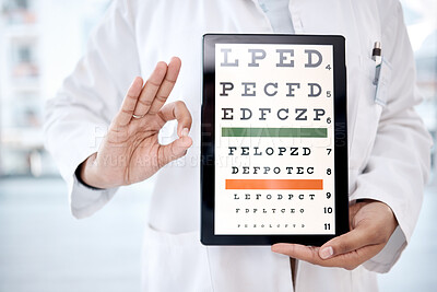 Buy stock photo Hands, tablet screen and snellen chart in hospital for vision examination in clinic. Healthcare, ok gesture or woman, ophthalmologist or medical doctor holding technology showing letters for eye test