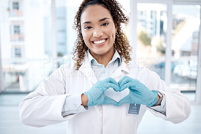 Buy stock photo Woman, love and heart hands portrait in hospital for care, trust and support on valentines. Healthcare, dentist and happy black female doctor with hand gesture for affection, romance and kindness.