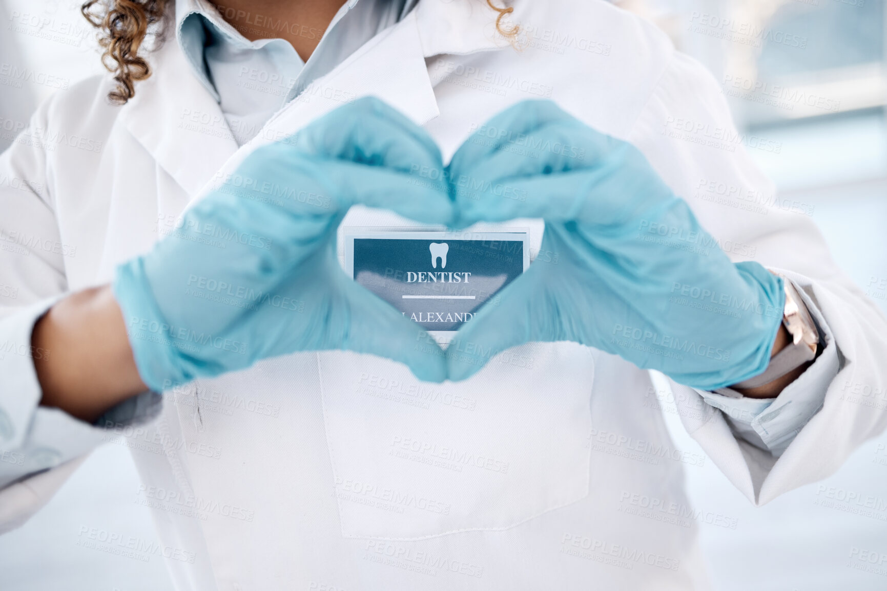 Buy stock photo Closeup, hands and dentist with heart, woman and health for wellness, care and support. Love sign, zoom and female medical professional for dental hygiene, solidarity and innovation with blue gloves