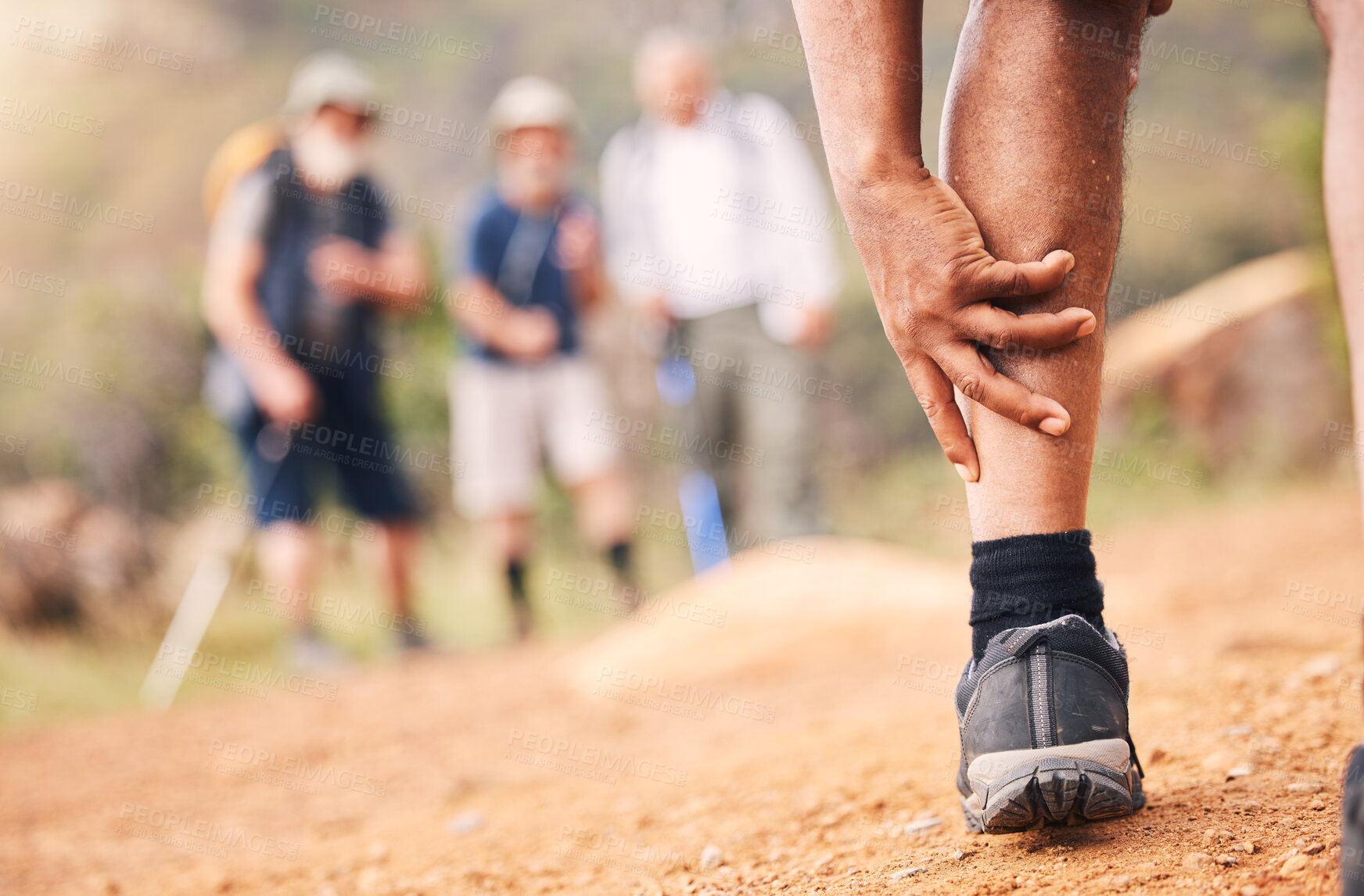 Buy stock photo Injury, leg pain and hands of senior black man after hiking or sports accident outdoors. Training hike, elderly and male with fibromyalgia, inflammation or arthritis, broken bones or painful muscles.