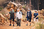 Hiking, nature and motivation with old men on mountain for fitness, trekking or backpacking adventure. Explorer, discovery and expedition with friends mountaineering for health, retirement or journey