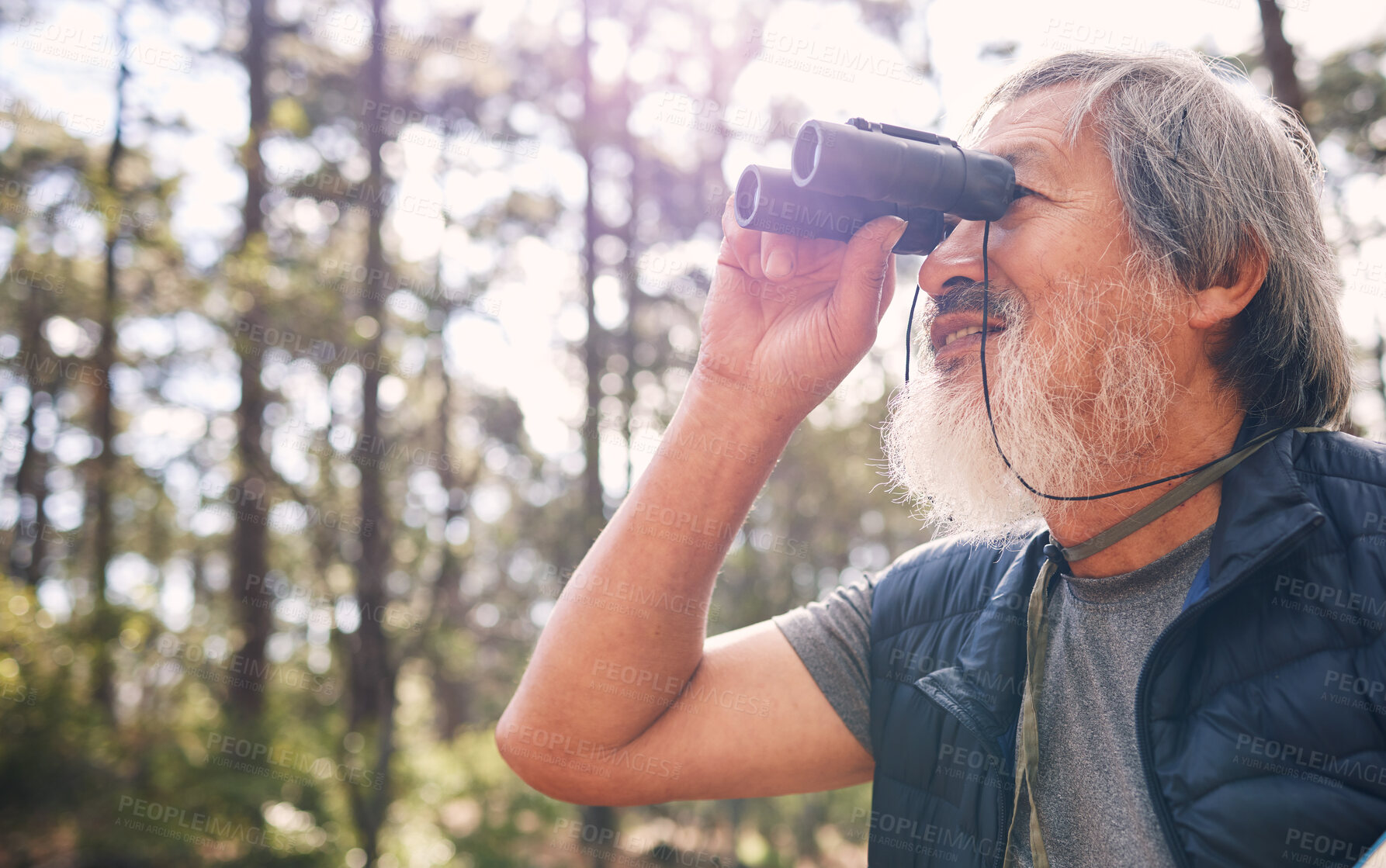 Buy stock photo Binoculars, senior man and hiking in nature looking at view, sightseeing or watching. Binocular, adventure search and elderly male with field glasses, trekking or exploring on vacation outdoors.