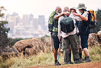Hiking, city and hug with old men on mountain for fitness, trekking and backpacking adventure with mockup. Support, motivation and expedition with friends on trail for health, retirement and journey