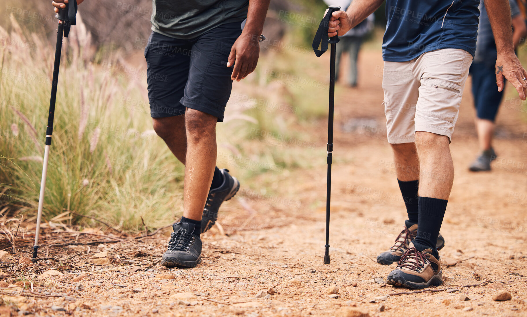 Buy stock photo Hiking, fitness and feet of people walking on mountain for adventure, freedom and journey in nature. Travel, retirement and shoes of hikers with walk cane for exercise wellness, trekking and workout
