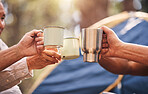 Camping hands, mugs and people toast on outdoor nature vacation for wellness, freedom or natural forest peace. Drinks, group cheers and relax friends celebrate on holiday adventure in Australia woods
