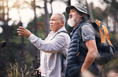 Buy stock photo Looking, pointing and mature men in nature for hiking, retirement travel and backpacking in Nepal. Walking, adventure and senior friends on a search while bird watching in the mountains on a walk