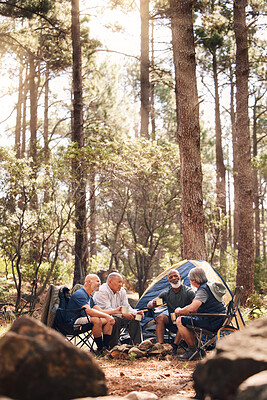 Buy stock photo Man, people and camping in nature for travel, adventure or summer vacation together with chairs and tent in forest. Group of men relaxing and talking enjoying camp out by tall green trees in outdoors