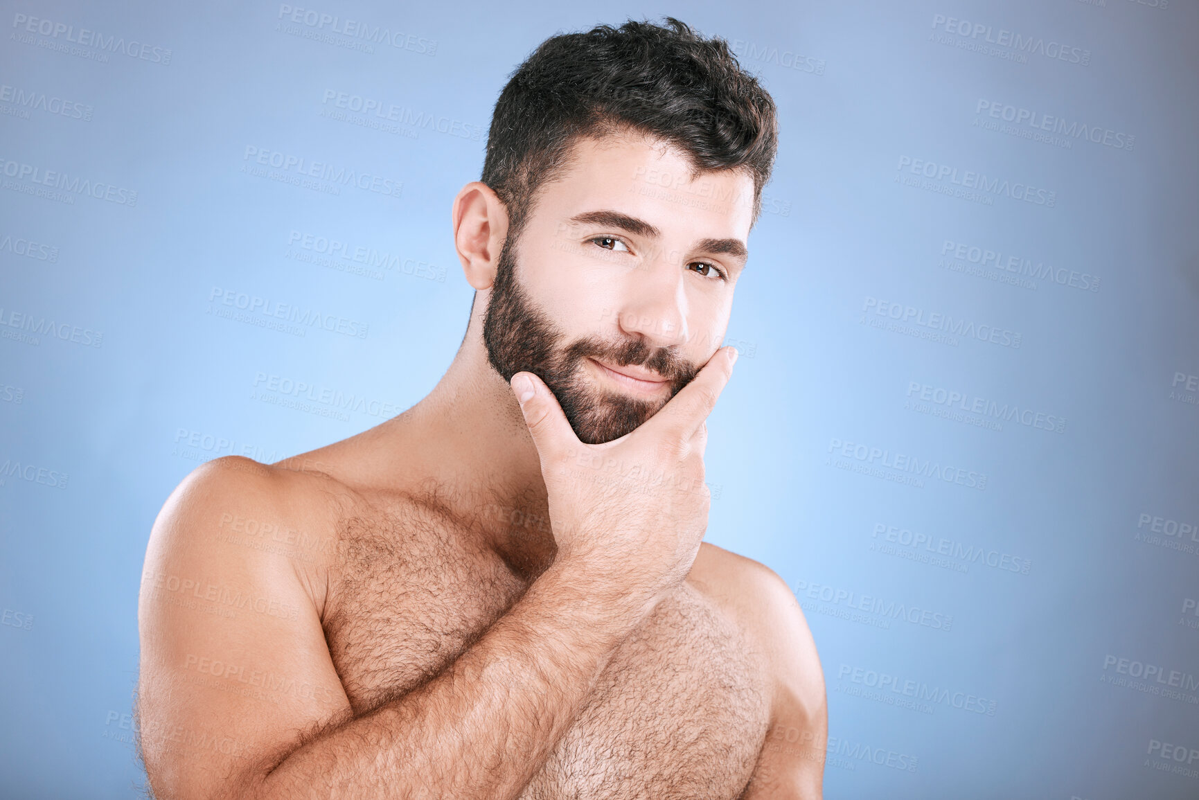 Buy stock photo Skincare, portrait of man and hand on beard, confidence and face cleaning treatment isolated on blue background. Facial hygiene, male model grooming shave and health, wellness and skin care in studio