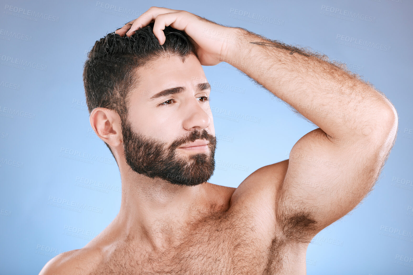 Buy stock photo Skincare, beauty and face of man with muscle on blue background for grooming, cleaning and cosmetics. Luxury spa, hair care and confident male flex bicep for healthy skin, body wellness and facial