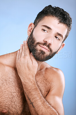 Buy stock photo Idea, skin and grooming with a man model in studio on a blue background for natural wellness or beauty. Face, beard and skincare with a handsome young male thinking about cosmetics or treatment