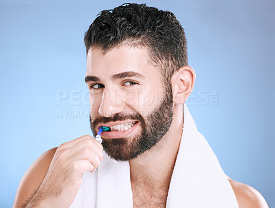 Buy stock photo Studio portrait, man and toothbrush for teeth, dental wellness and healthy smile, mouth and cleaning. Happy male model, oral care and fresh breath for gums, dentistry and hygiene on blue background 