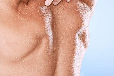 Buy stock photo Man, back and water drops from shower, hygiene closeup with sweat and skincare on blue background. Wet skin, clean and moisture with grooming, cosmetics and body cleaning, wellness and beauty