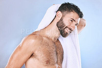 Buy stock photo Man after shower with hygiene, towel and beauty, smile and grooming with wellness in studio. Skincare, cosmetics and cleaning body with healthy skin, dermatology and cosmetic care on blue background