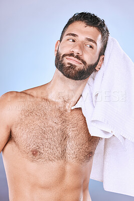 Buy stock photo Man, shower with hygiene, towel and grooming for beauty in, smile and face in studio. Skincare, natural cosmetics and cleaning body with healthy skin, fresh and cosmetic care on blue background