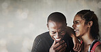 Fitness, happy and couple laughing in a studio after a workout or sports training together. Happiness, smile and excited interracial man and woman athletes by a brown background with mockup space.