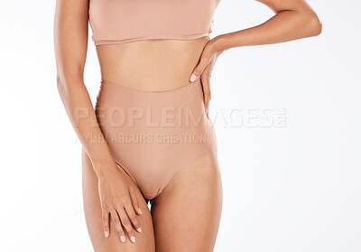 Health, slim and body of a woman in underwear isolated on a white  background in a studio. Wellness, beauty and stomach of a fitness girl with  a slimming shape, attradctive and in