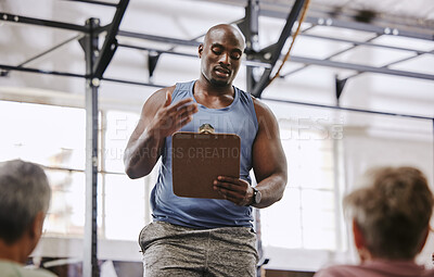 Buy stock photo Coaching, gym checklist and black man talking to senior clients at training introduction, welcome or membership. Personal trainer fitness, workout or exercise schedule, sign up and USA community club