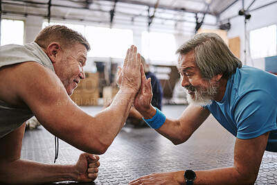 Buy stock photo Fitness, old men on ground and high five for target, training goals and excited in gym. Senior male athletes, happy elderly citizens and gesture for achievement, exercise or teamwork on ground in gym