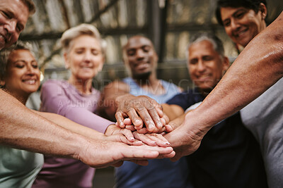 Buy stock photo Teamwork, hands together and senior people in gym for motivation, solidarity and team building. Collaboration, group  of friends or retired men and women huddle for workout goals and training targets