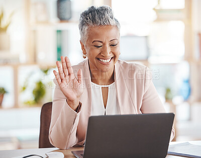 Buy stock photo Video call, online and senior business woman waving greeting on internet, website or web conference from her office. Elderly, corporate and professional or executive employee using laptop for meeting