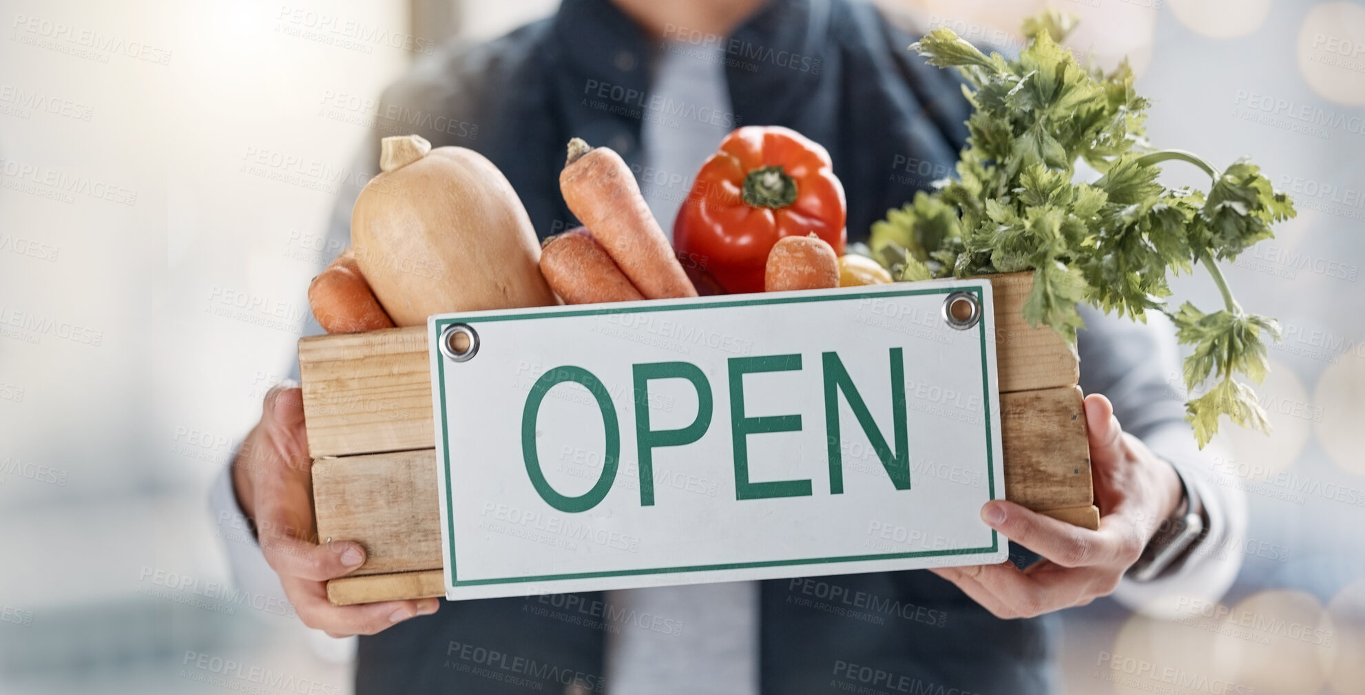 Buy stock photo Vegetables, market and person holding food basket with open sign as delivery of groceries from online shop. Closeup, hands and courier with fresh products from organic farm for a vegetarian