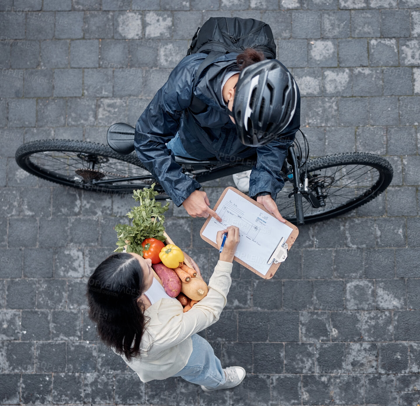 Buy stock photo Signature, courier and woman with grocery delivery, supermarket service and giving of food. Ecommerce, package and above of a customer signing a document for groceries from a retail worker in street