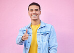 Thumbs up, motivation and portrait of a man with a thank you isolated on a pink background in studio. Success, win and person with a hand sign for support, trust and emoji icon for agreement