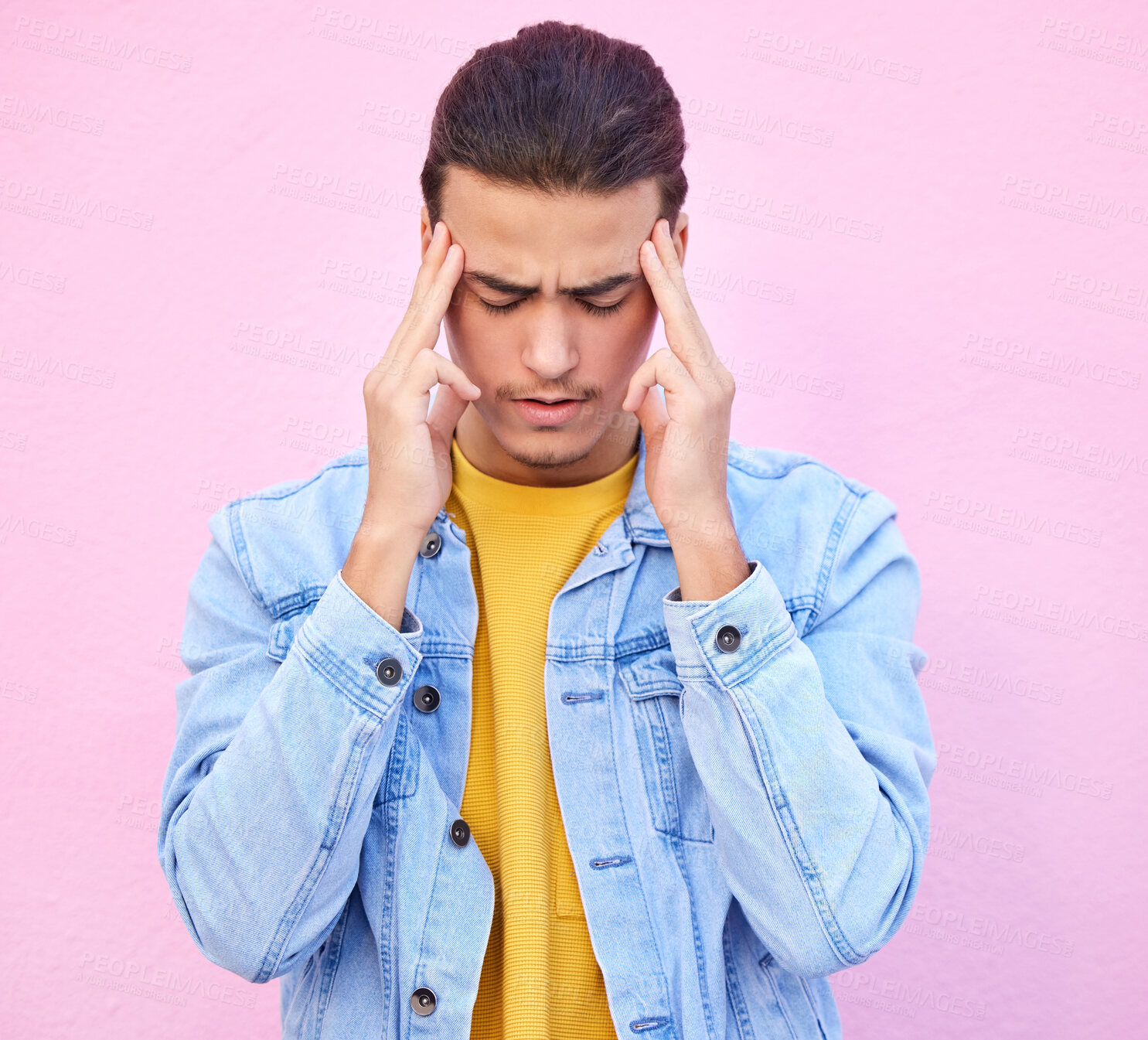 Buy stock photo Depression, stress and man with headache in studio isolated on a pink background. Mental health, anxiety and  depressed, unhappy or sad male model with problem, pain or migraine, burnout or fatigue.