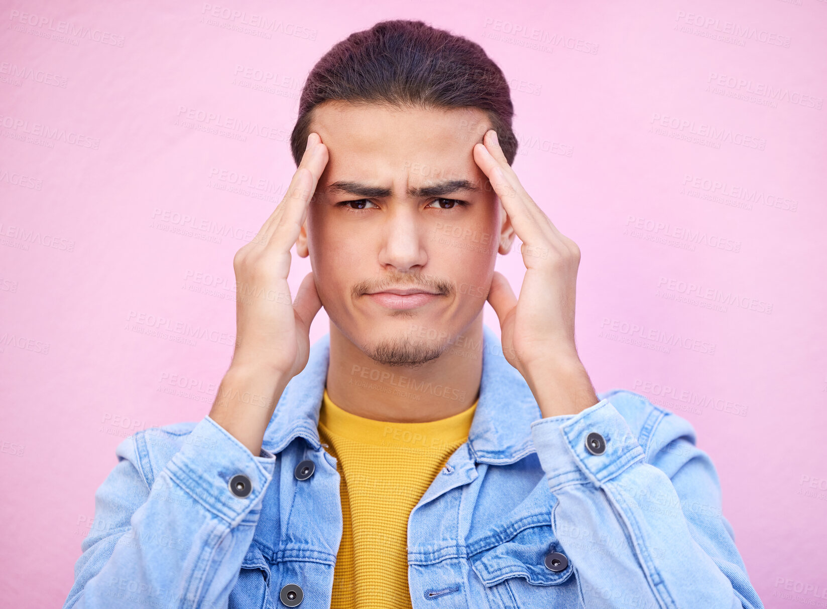 Buy stock photo Portrait, stress and man with headache in studio isolated on a pink background. Mental health, anxiety and face of depressed and sad male model with depression, pain or migraine, burnout or head ache