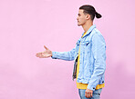 Hand shake, meeting and deal with man and wall background with mockup for greeting, agreement or thank you. Partnership, hello and approve with profile of guy and pink background for positive gesture