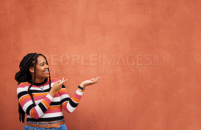 Mockup, happy or black woman with marketing, product placement or branding space on wall background. Smile or African gen z girl advertising discount deal, sales offer or promotion announcement