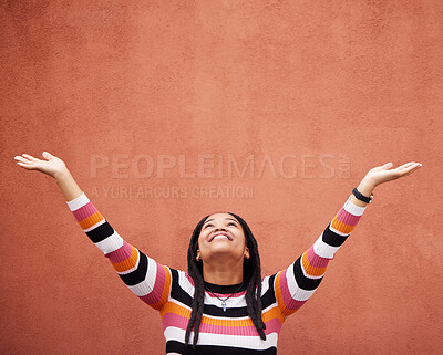 Buy stock photo Black woman, hands up and wall background with space for mockup with smile, happy and excited in city. Young gen z girl, outdoor and happiness with mock up, fashion and palm with product placement