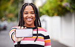 Phone, mockup and screen, portrait and black woman in road for travel, advertising and copy space. Face, smartphone and display by student traveling, connect or social media app on blurred background