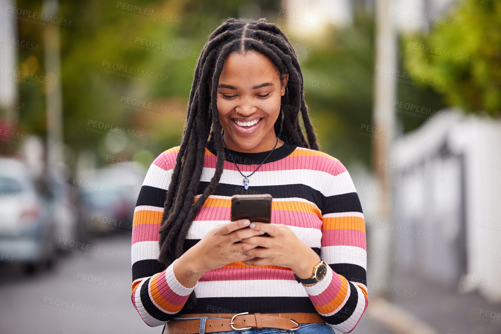 Buy stock photo Black woman with smartphone in city, happy outdoor with technology, chat and communication, travel and fashion. Social media, urban street and adventure with happiness, connectivity and 5g in Jamaica