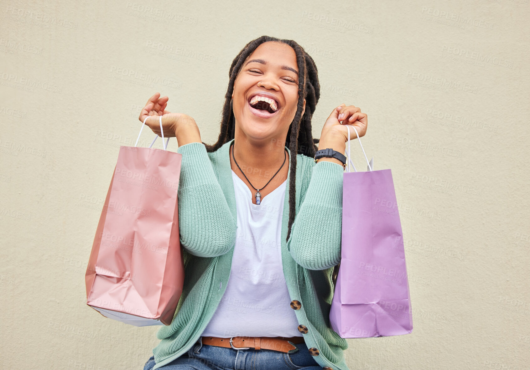 Buy stock photo Fashion, funny or happy black woman with shopping bag, gift or smile in retail therapy with wall mockup. Freedom, relax or excited customer laughing with clothes or products on discounted sales offer