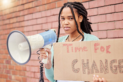 Buy stock photo Portrait, poster and woman on megaphone for change, protest or human rights on brick wall background. Billboard, speaker and face of girl for announcement of global, transformation or freedom mission