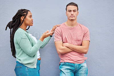Buy stock photo Interracial couple, wall background and argument in metro with black woman, question and conversation. Young gen z man, partner and conflict in city with relationship, fight and  angry arms crossed
