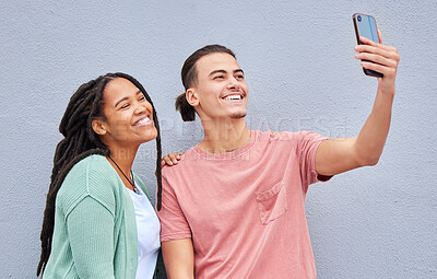 Buy stock photo Love, friends and selfie with smile, casual and wall with freedom, trendy and loving together. Black woman, man and smartphone for picture, share post and social media on studio background and happy