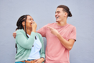 Buy stock photo Joking, laughing and happy with a couple on a gray background, outdoor for fun or freedom together. Laughter, humor or smile with a young man and woman enjoying laughter while bonding against a wall