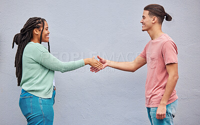 Buy stock photo Friends, handshake or meeting on isolated background in collaboration, teamwork mockup or partnership support. Smile, happy or shaking hands for man, black woman or students in relax fashion clothes