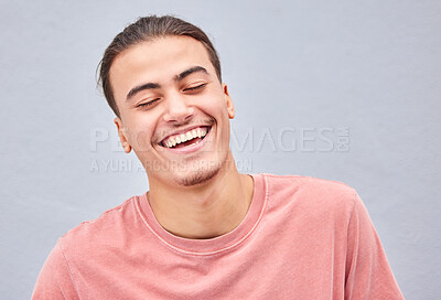 Buy stock photo Man, face or laughing on isolated background at funny joke, meme or comedy on grey mockup, model wall or mock up backdrop. Smile, happy or comic student in fashion, trendy style or cool relax clothes