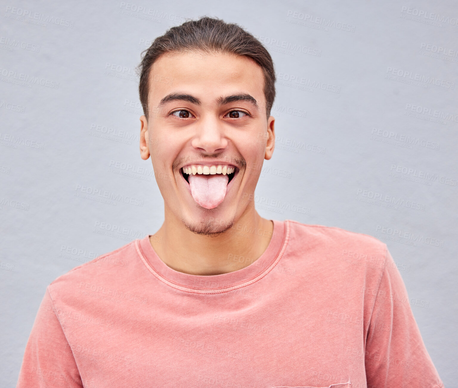 Buy stock photo Man, tongue or funny face on isolated background in silly, goofy or comedy on grey mockup, wall or mock up backdrop. Comic, emoji or happy student in fashion clothes, style trend or facial expression