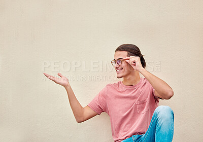 Buy stock photo Mockup, hands and happy man pointing to space for advertising, empty and grey wall background. Hand, gesture and guy relax, content and smile in studio for product placement, marketing and copy space