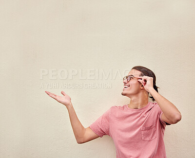 Buy stock photo Hands, mockup and happy man pointing to space for advertising, empty and studio background. Smile, hand gesture and guy relax, content and showing wall for product placement, marketing and copy space