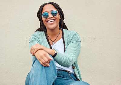 Buy stock photo Black woman, sunglasses and city by wall for portrait, happy and smile with fashion in summer. Young gen z, african student girl and outdoor for travel, urban adventure and aesthetic with happiness
