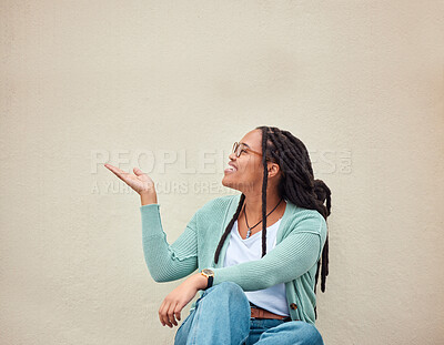Buy stock photo Happy, black woman and hands pointing to mockup for advertising, space or wall background. Smile, hand gesture and girl excited on product placement, idea or marketing copy space, relax and isolated