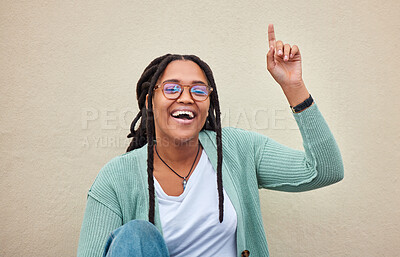 Buy stock photo Up sign, portrait and black woman pointing with mockup in studio for advertising, space and wall background. Face, direction and girl happy, smile and excited for product placement on copy space