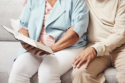Buy stock photo Hands, bible and praying with an old couple reading a book together in the home during retirement. Jesus, faith or belief with a senior man and woman in prayer to god in a house for spiritual bonding