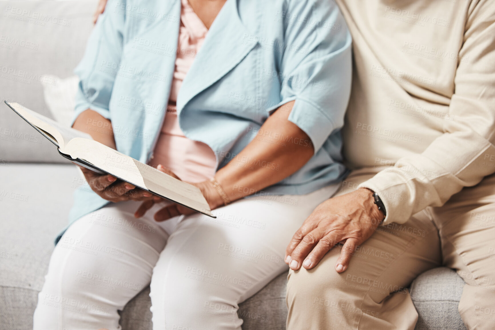 Buy stock photo Hands, bible and praying with an old couple reading a book together in the home during retirement. Jesus, faith or belief with a senior man and woman in prayer to god in a house for spiritual bonding